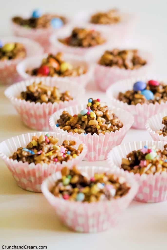 chocolate rice krispie cakes clustered together with sprinkles on top