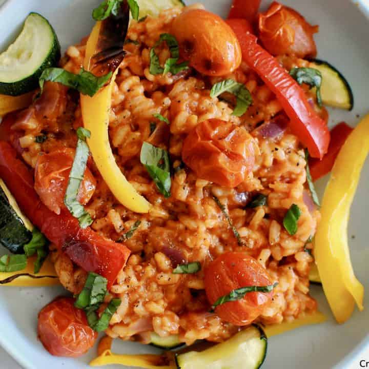 A rich and creamy risotto made with crushed tomatoes, served with chargrilled peppers, tomatoes and courgette to form a comforting and hearty vegetarian dinner.