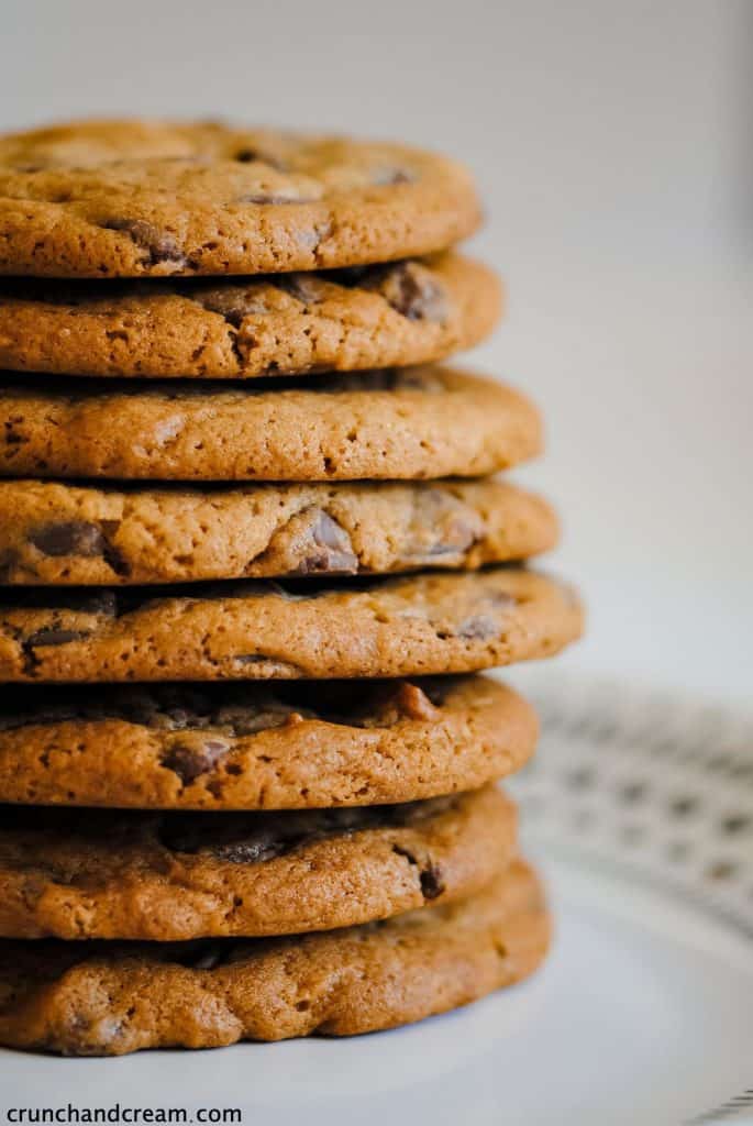 a stack of thick chocolate chip cookies