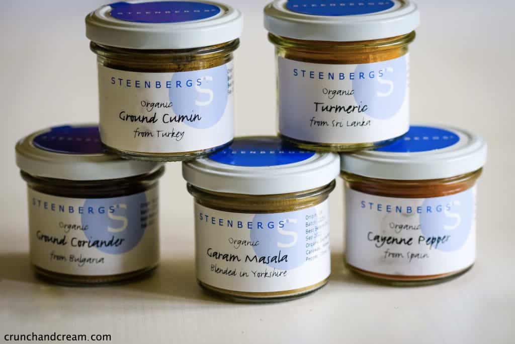 jars of steenbergs spices - garam masala, cumin, coriander, cayenne and turmeric