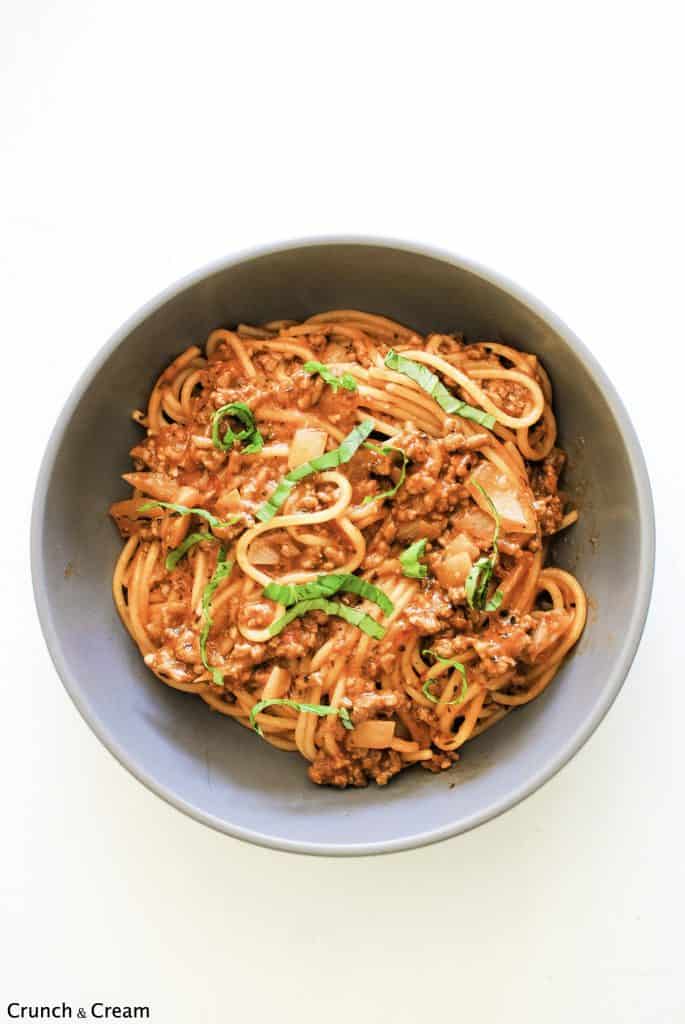 overhead of a bowl of spaghetti bolognese